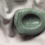 impression from intaglio - Cupid on a Dolphin.