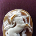 Centaur. Sea Shell. size 3 x 2.5cm
Hight relief cameo is carved on a black -
white organic material - natural colors are
used.