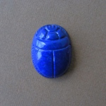 Antique Egypt culture image.
Scarab. size 2.5 x 1.9cm  Lapis lazulit.The Scarab motive was among
central thems of Antique Egypt jewelry. Scarabs figure is strong polished.
All detailes are carved.