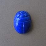 Antique Egypt culture image.
Scarab. size 2.5 x 1.9cm  Lapis lazulit.The Scarab motive was among
central thems of Antique Egypt jewelry. Scarabs figure is strong polished.
All detailes are carved.