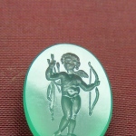 Cupid with a bow and arrows.
Chrysoprase. Size  1.5 x 1.2 cm
Intaglio.